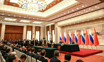 Россия и Китай выступают за защиту международного права, заявил Путин